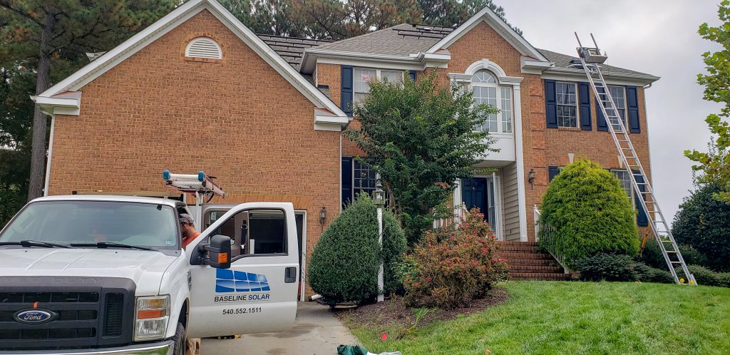 image of solar installers working on a residential home