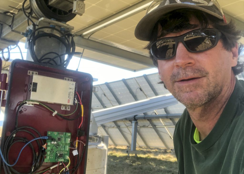 Electrician working on solar tracking system.